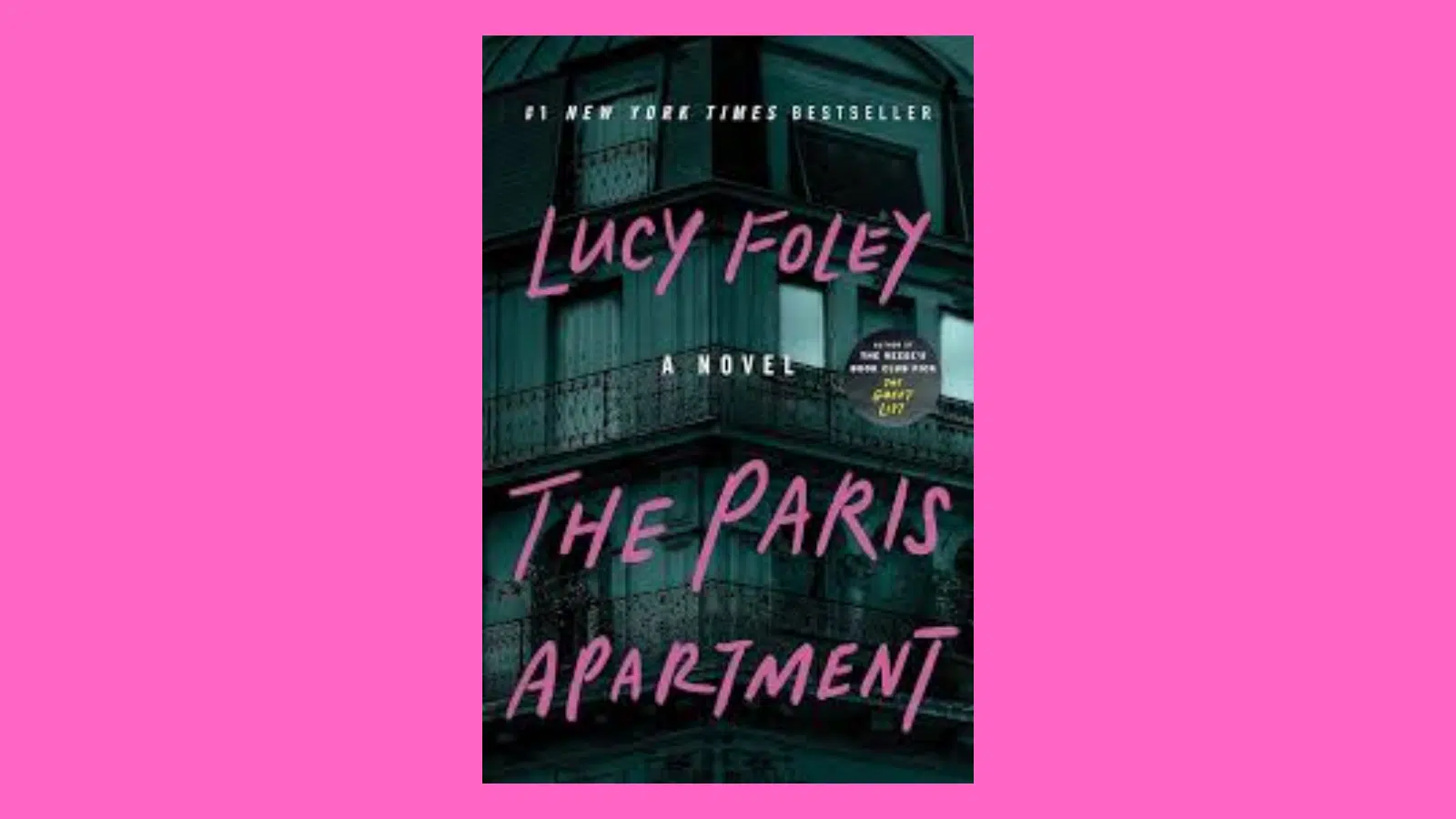 The cover of the book The Paris Apartment is shown, featuring a Parisian apartment building